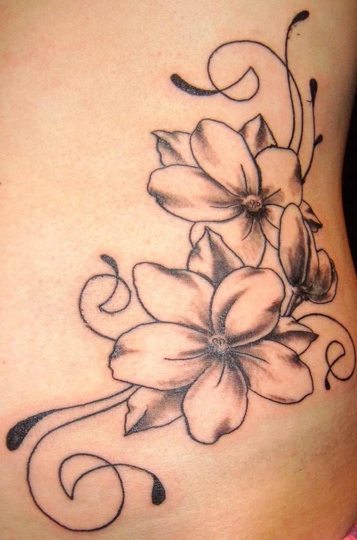 flower and swirls tattoo by